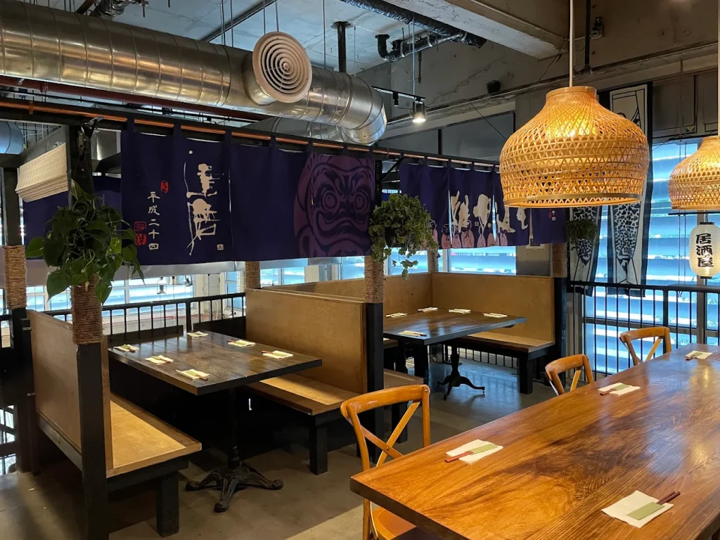 Private Dining area of Jin Ramen. There are two booths and a long table visible. 